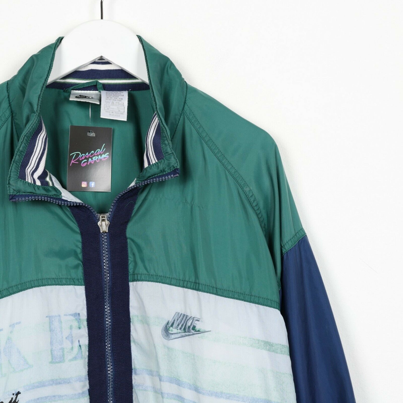 green and blue nike windbreaker