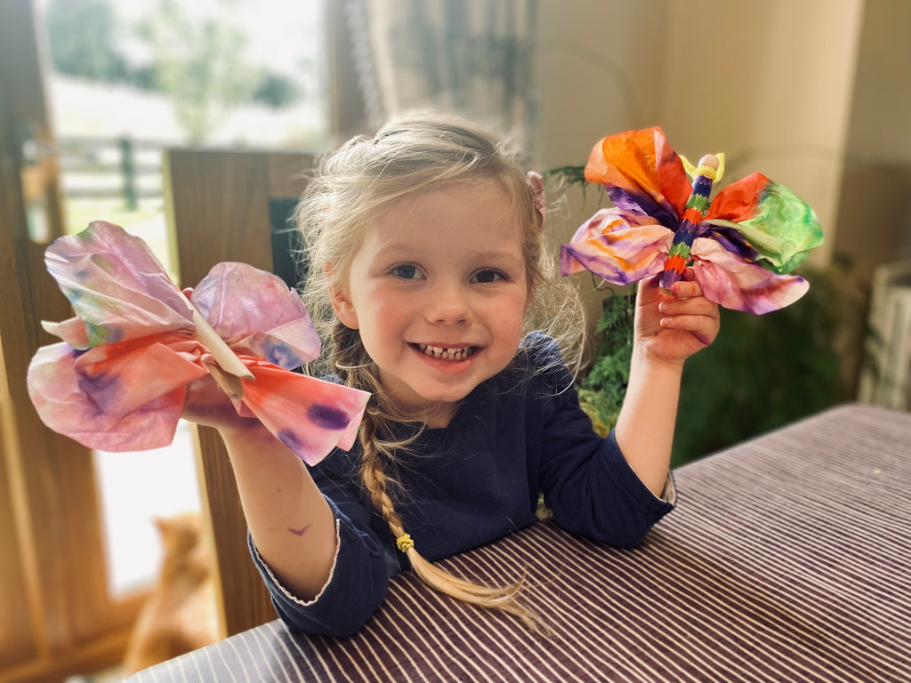 child-showing-a-butterfly-craft-creative-education.jpeg