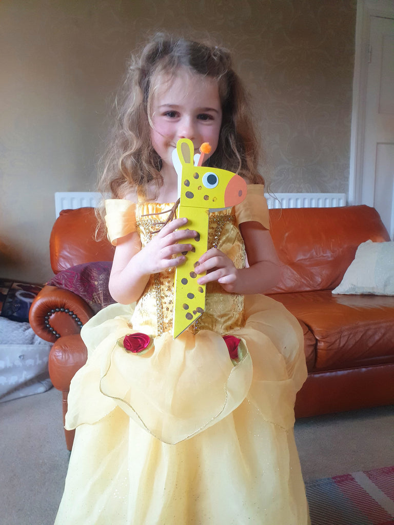 child-showing-her-giraffe-craft