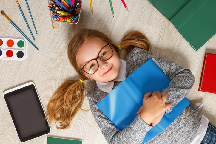 child-surrounded-by-books