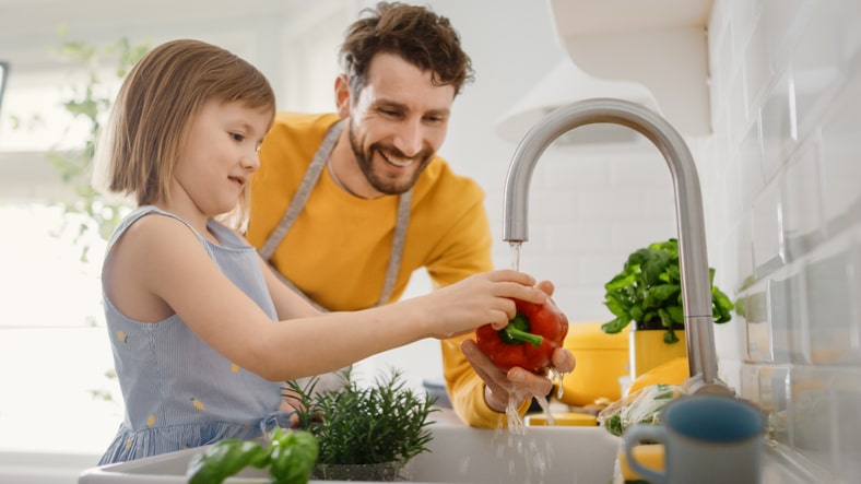cooking-with-childrne-girl-learning-to-wash-vegetables.jpg