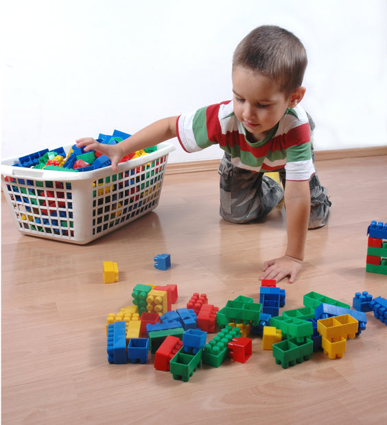 kid-cleaning-his-toys-physical-development.jpg