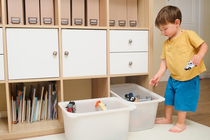 toddler-putting-away-his-toys.jpg