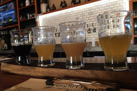 A flight of beer at a microbrewery.