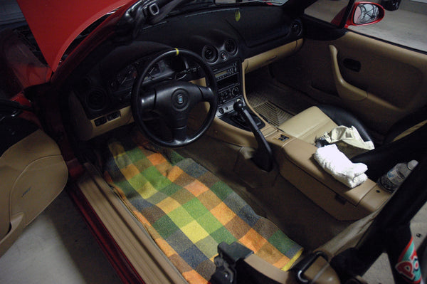 Blanket laid on driver's side floor.