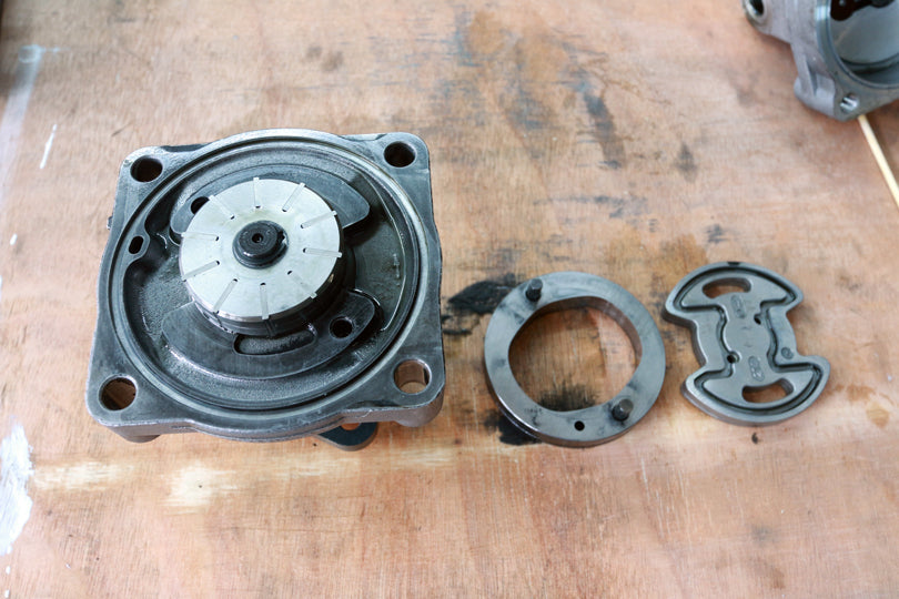 BMW E36 M3 power steering pump disassembly. Oval ring removed and set to the side.
