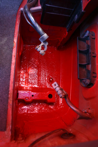 Battery compartment after spray painting red.
