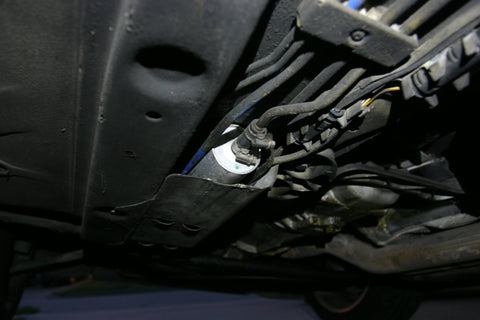 Underside of E36 M3 with fuel filter visible.