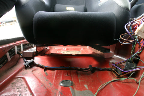 Mockup of aluminum bars under seat mount rails to verify fitment. Both flanges of the seat mount rails are pointing outboard.