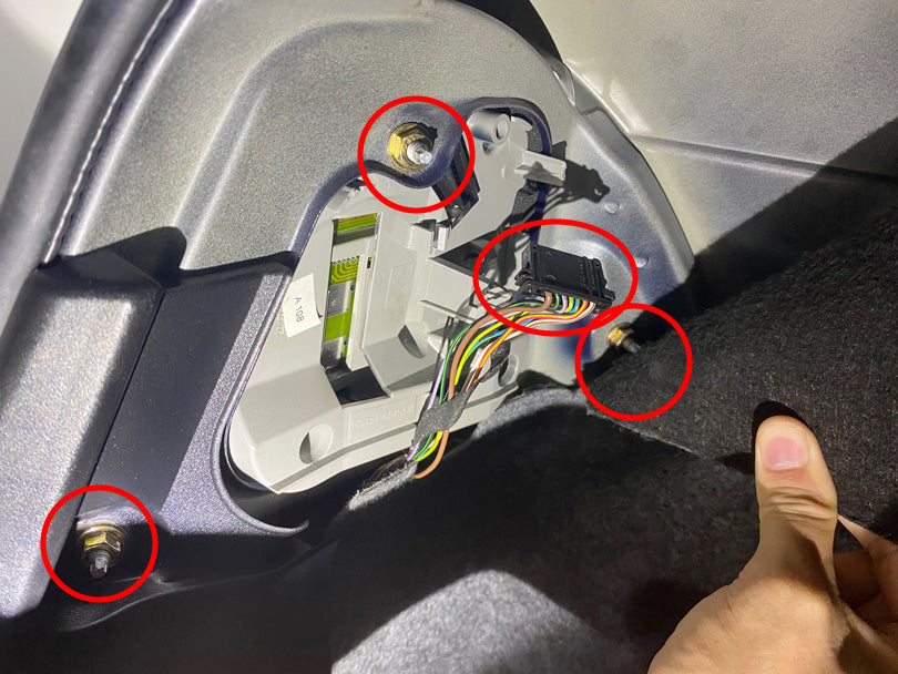 BMW E46 led taillight removal DIY. 3 nuts and connector that need to be removed are circled.