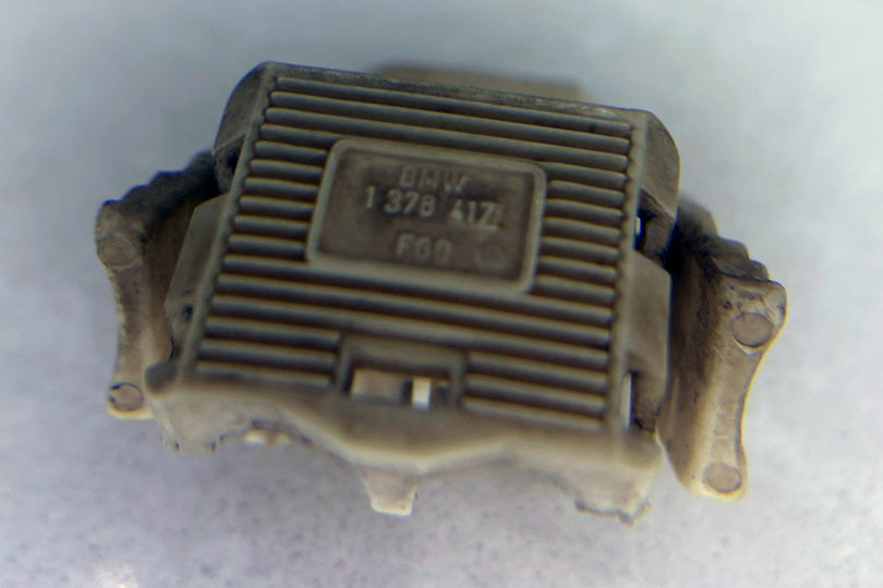 Harness connector with partial part number molded into the connector.
