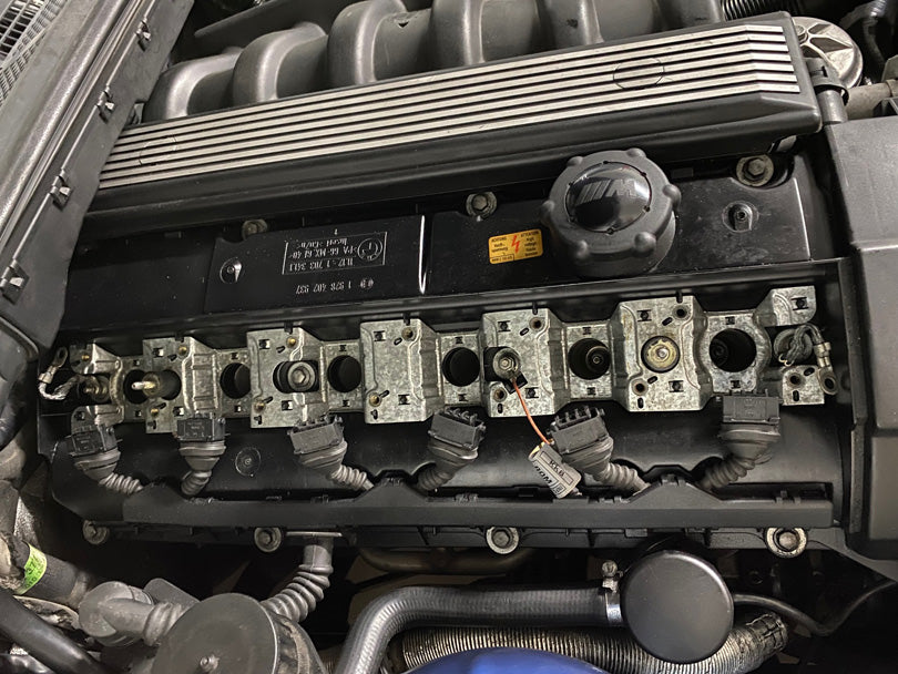 BMW E36 M3 S52 engine with ignition coils removed.