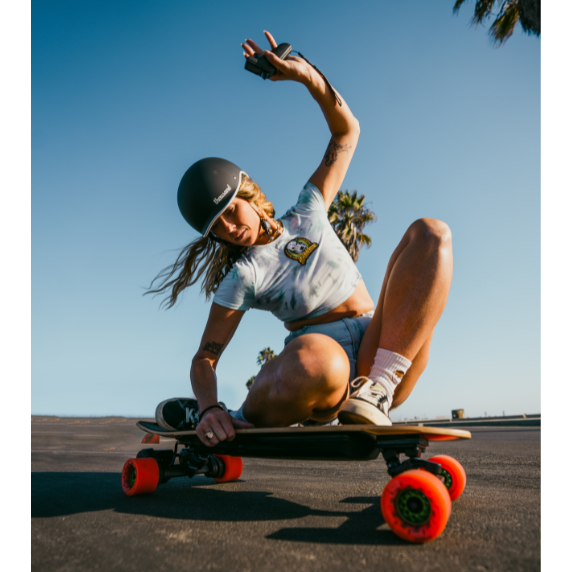 girl riding an electric skateboard