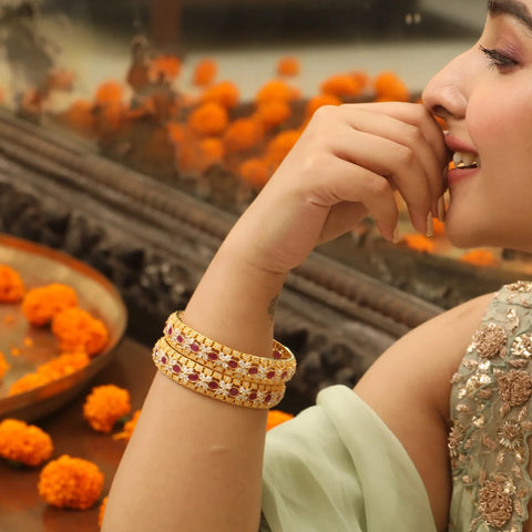An image of woman wearing a stunning pair of bangles.