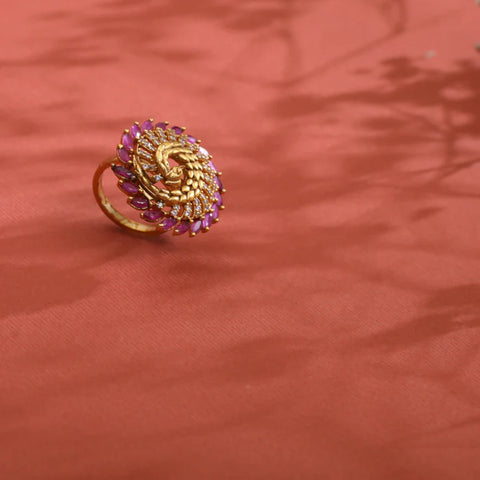 An image of an antique finger ring on an orange background