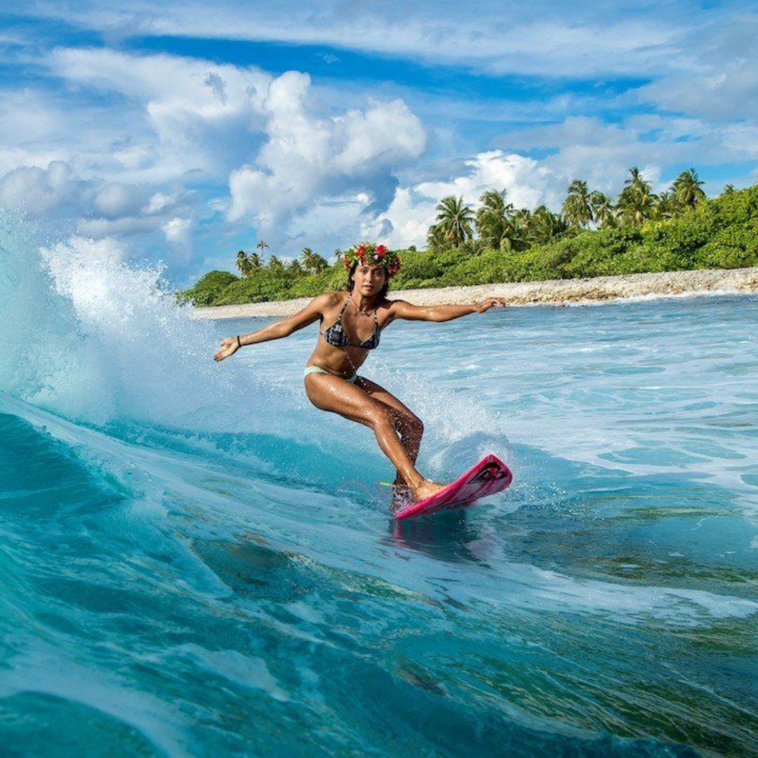 Surfing image from the documentary Daughters of the Wave