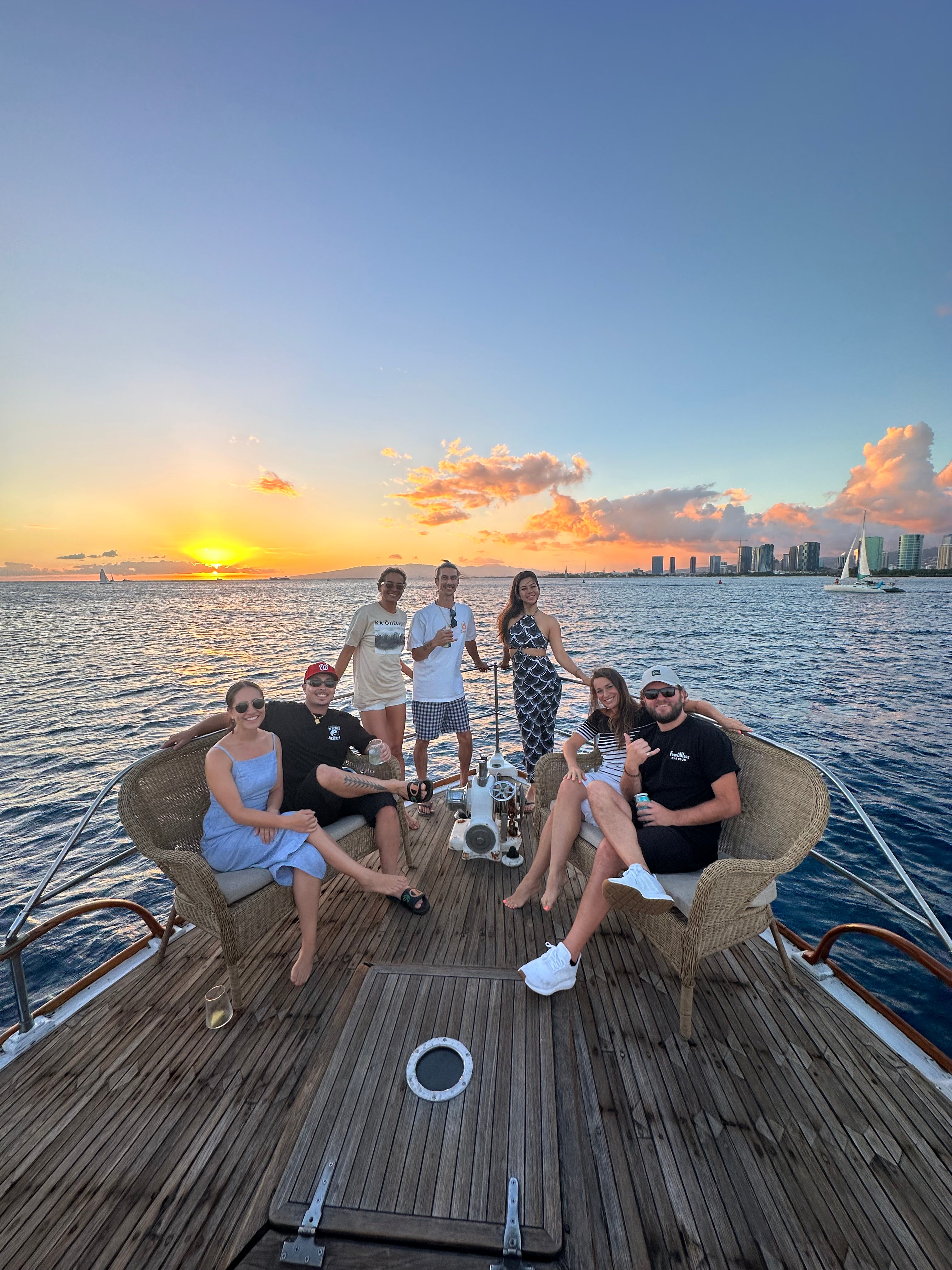 team aboard the Vida Mia at sunset