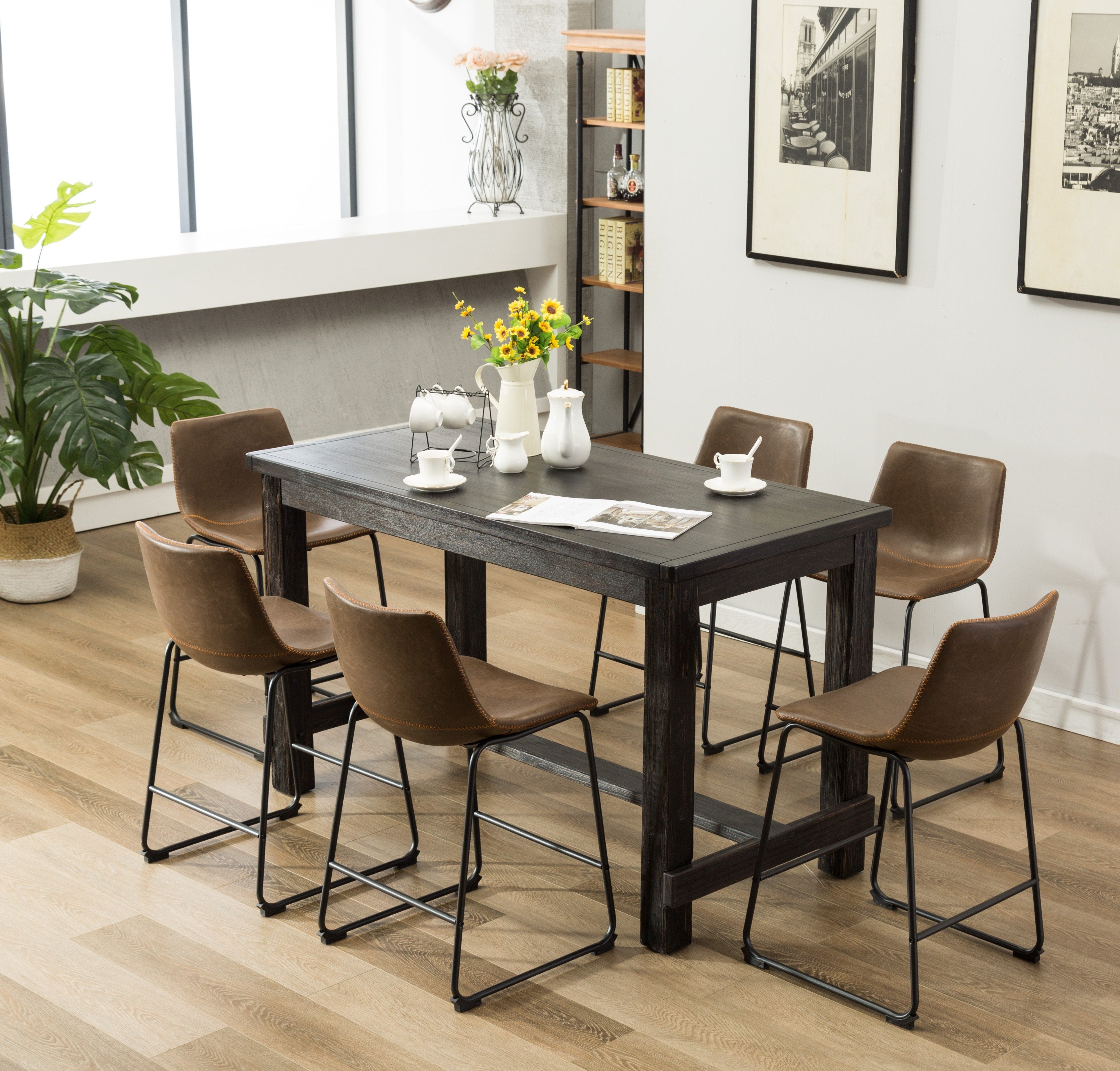 black dining table with leather chairs