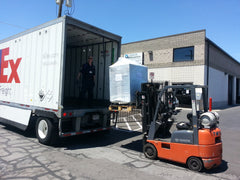 A reclaimed process water chiller being loaded for it's journey to a New Mexico distillery, the dream of a group of friends. 