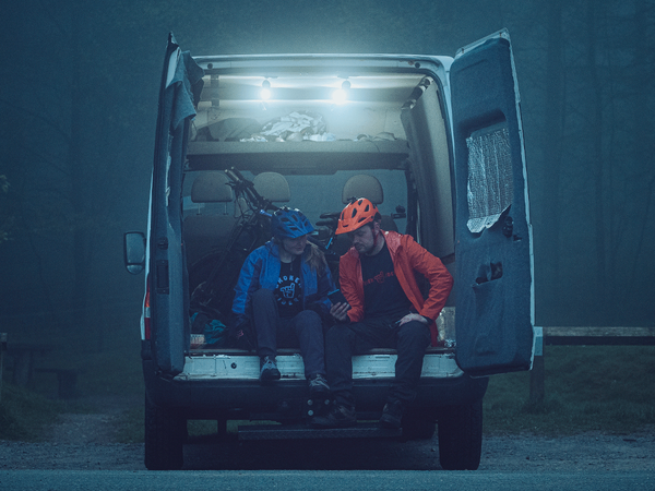 Mountain bikers sitting in a van