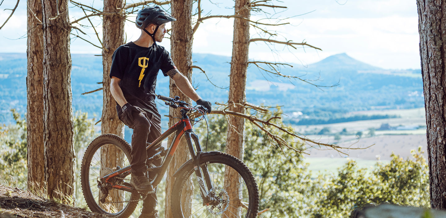 Rider wearing Broken Riders mountain bike tshirt