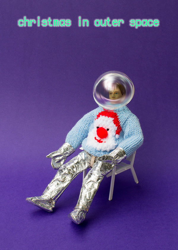 Christmas in Outer Space - astronaut in woolly jumper relaxing