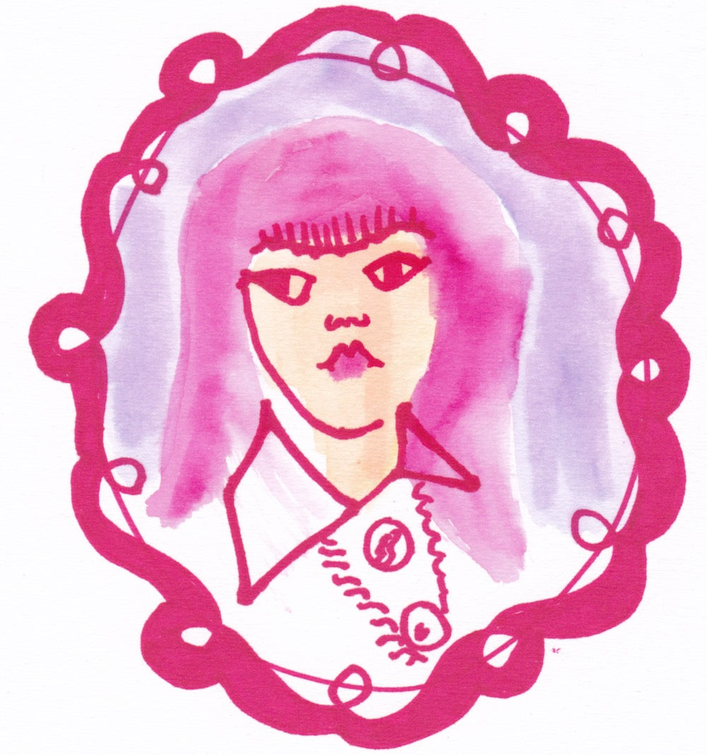 Close up of pink felt tip drawing of cartoon face.
