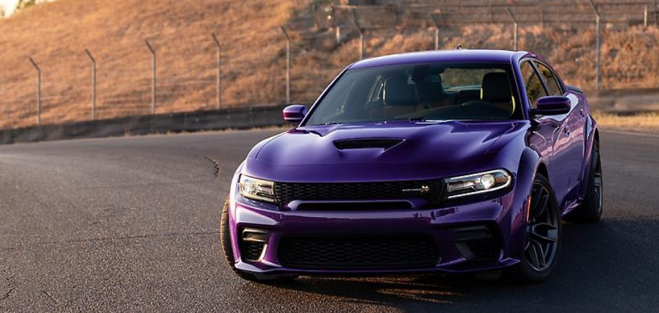 The 2023 Dodge Charger Scat Pack Widebody, shown in Plum Crazy. Dodge brand will celebrate its 2023 model lineup through a number of new initiatives, including by bringing back three beloved heritage exterior colors: B5 Blue, Plum Crazy purple and Sublime green. One popular modern color, Destroyer Grey, also returns to the fold.