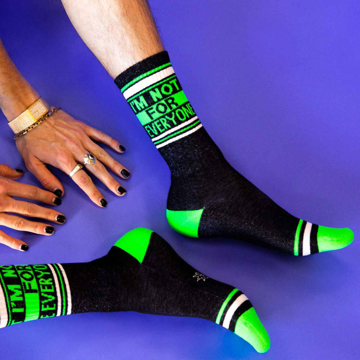 Black and green socks with the words "I'M NOT FOR EVERYONE"