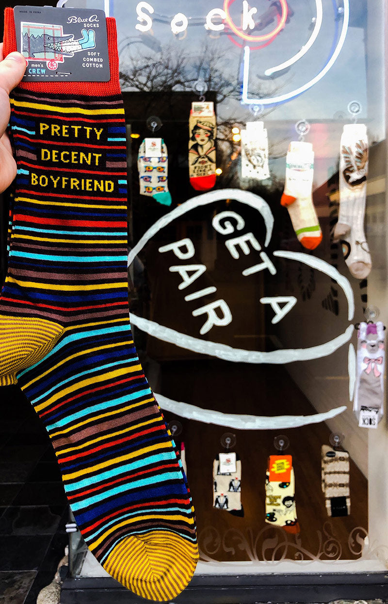 Funny men's socks that say "Pretty Decent Boyfriend."