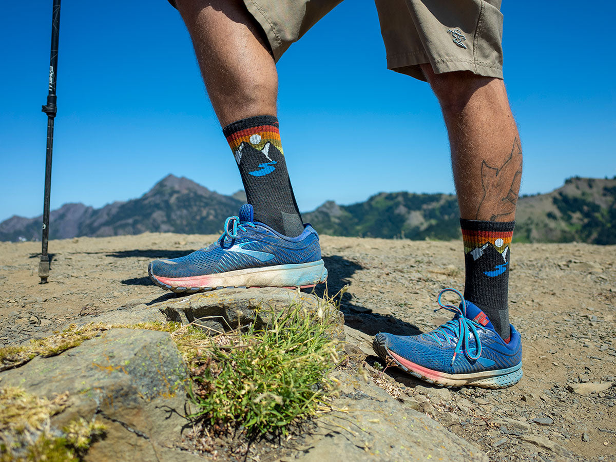 A man hiking with mountain socks and shorts