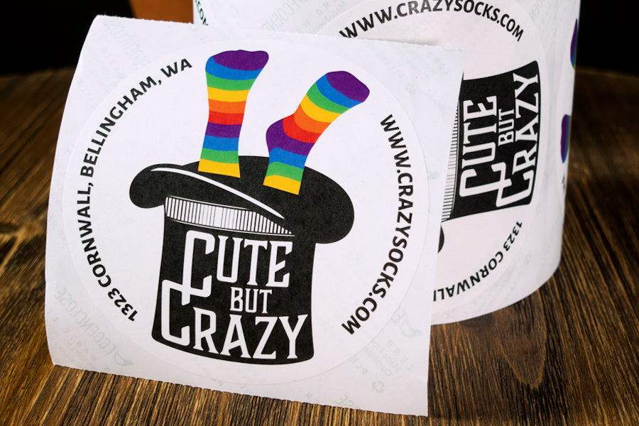 Sustainable stickers with the Cute But Crazy Socks logo