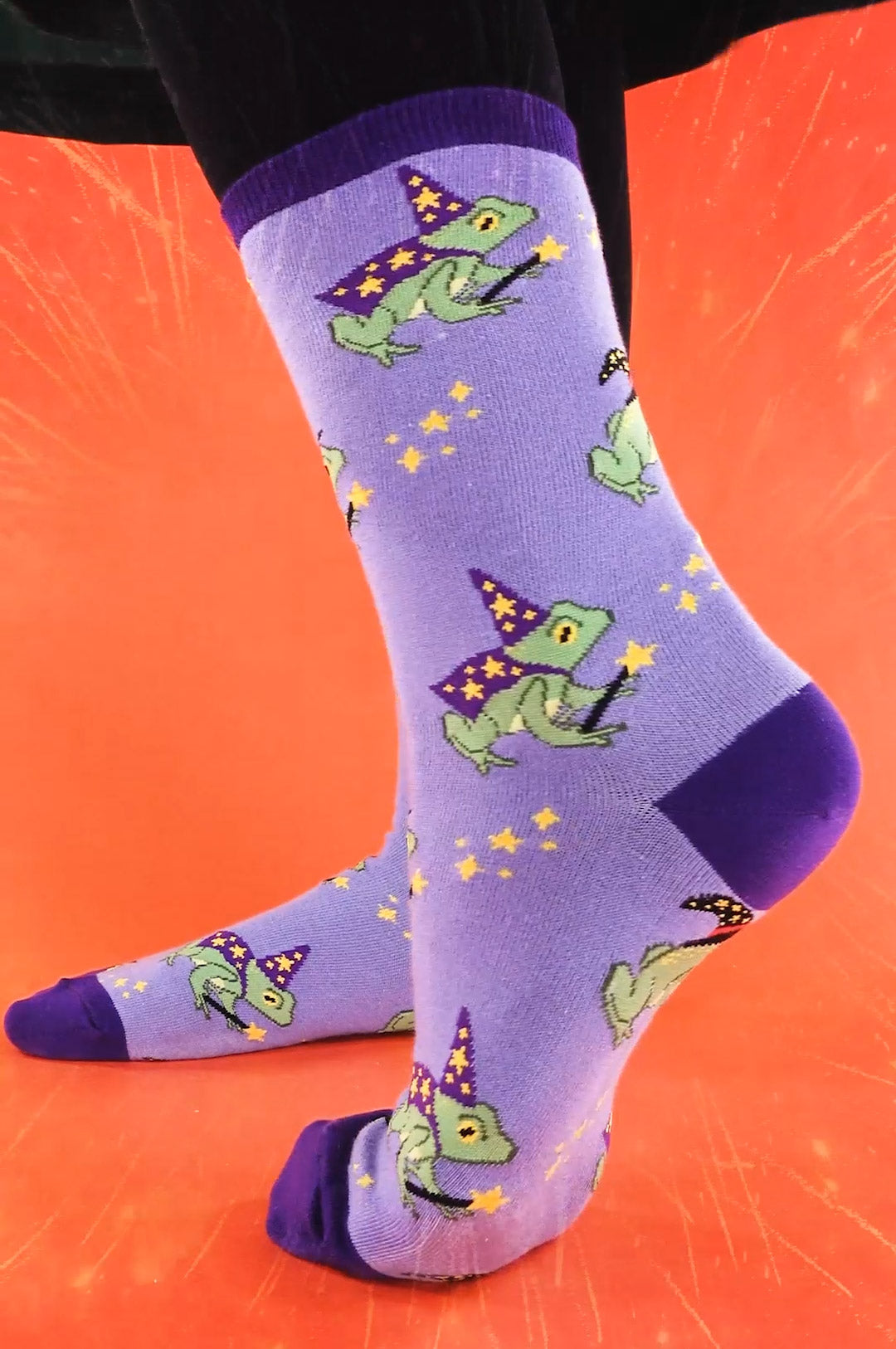 Frog socks with magician and wizard frogs on a purple background