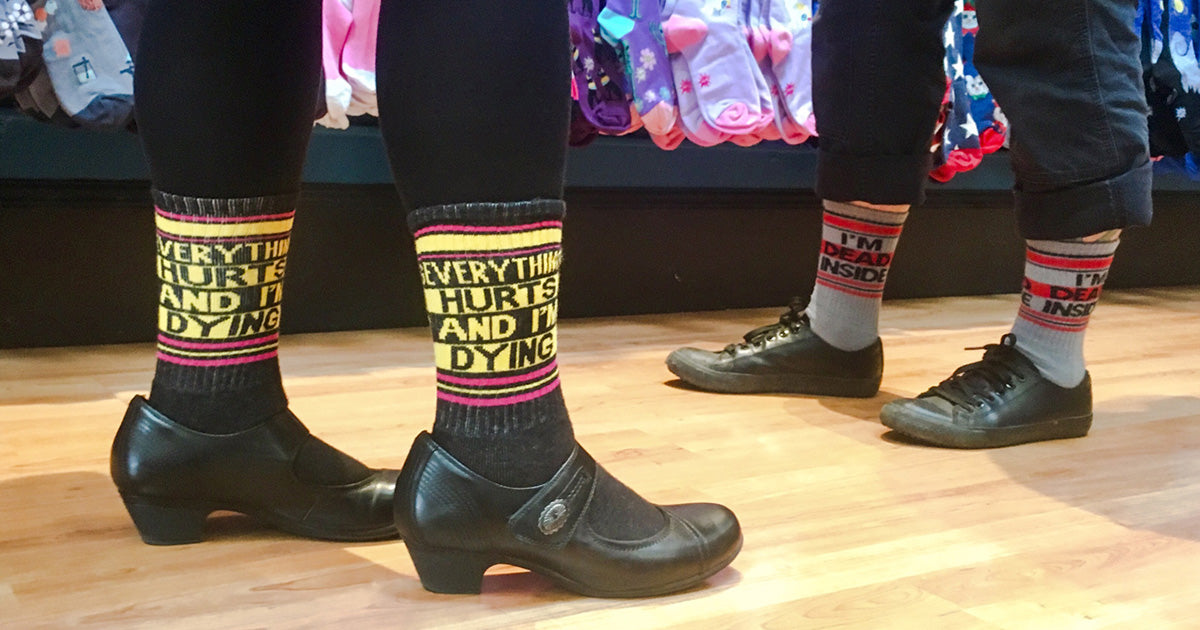 Funny statement socks for men and women that say "Everything Hurts and I'm Dying"