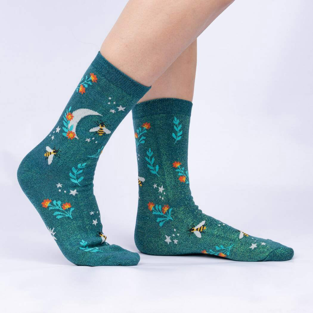 Fairycore bee socks with moons and bees on a shimmery green background