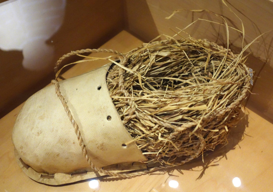 A replica of a shoe stuffed with hay found with Ötzi, a mummified man who lived between 3350 and 3105 BC 
