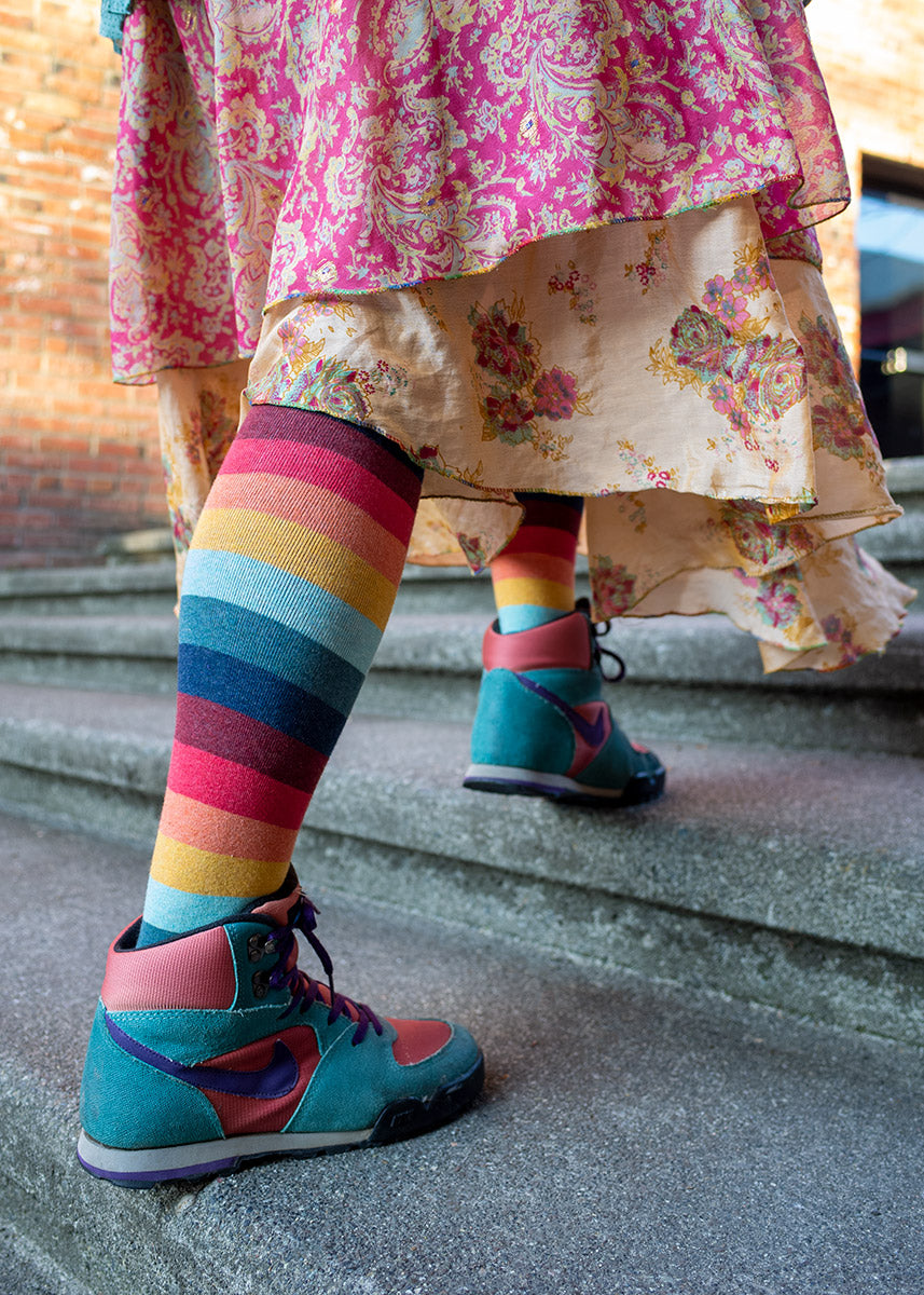 Knee-high '70s striped socks worn with dress and sneakers