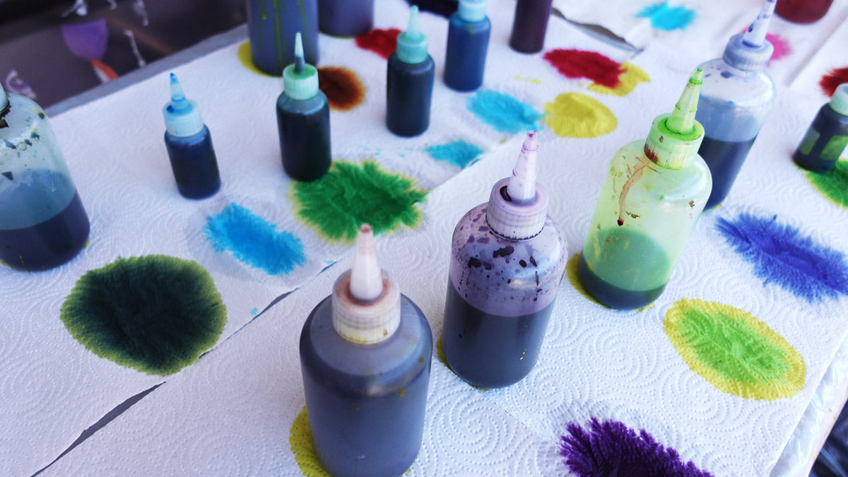 A set of fabric dyes in squeeze bottles for easy application on socks