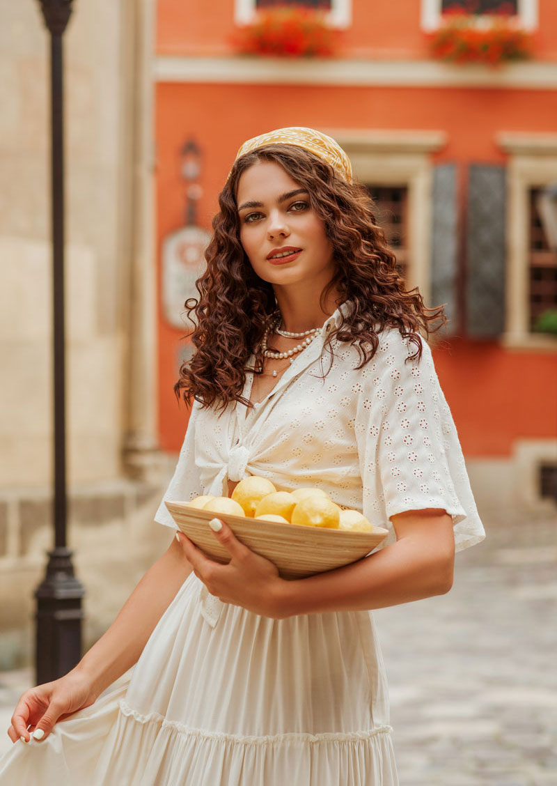 A tomato girl outfit example with a flowy white fabric dress