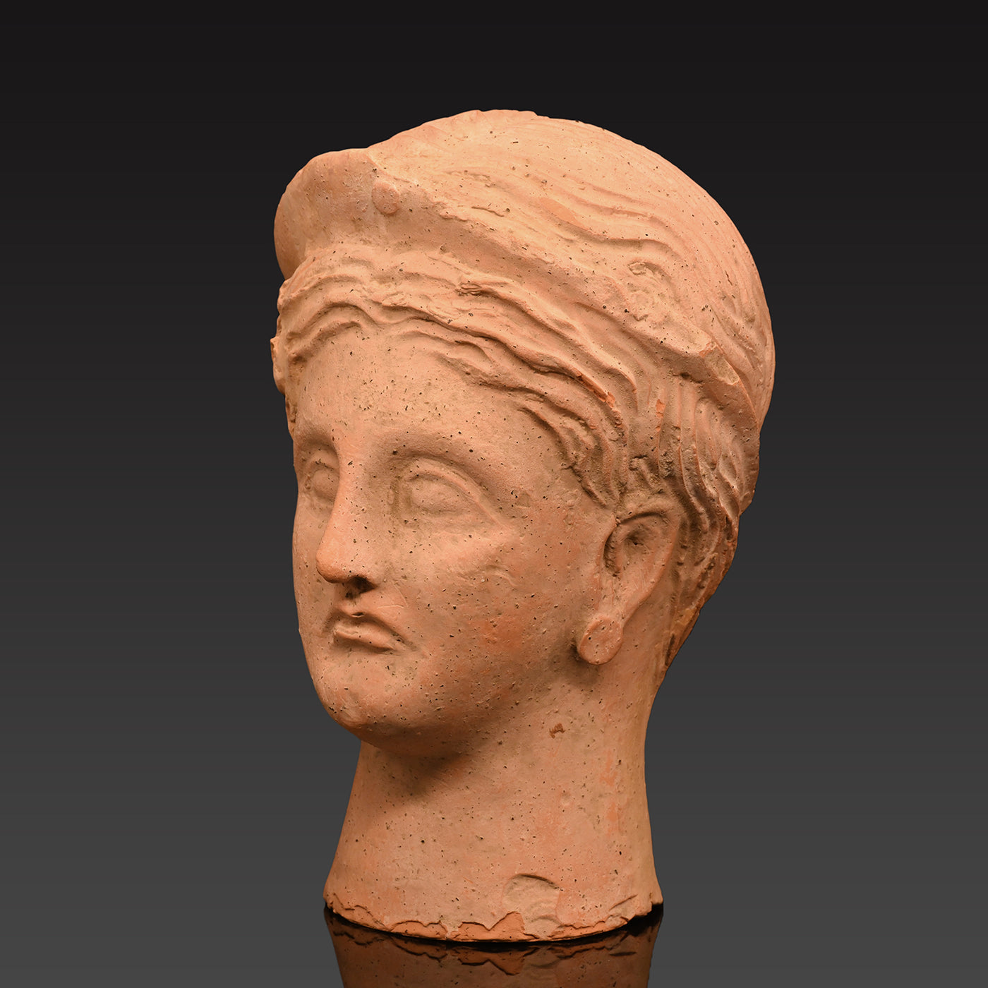 An Etruscan Terracotta Votive Head of A Goddess, ca. 4th - 3rd century BCE