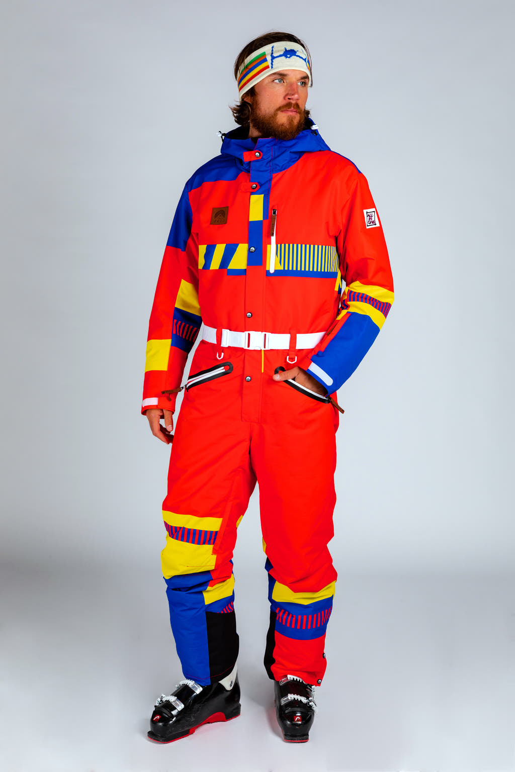 A man in a vintage ski suit, ready for a day of nostalgia and fun.