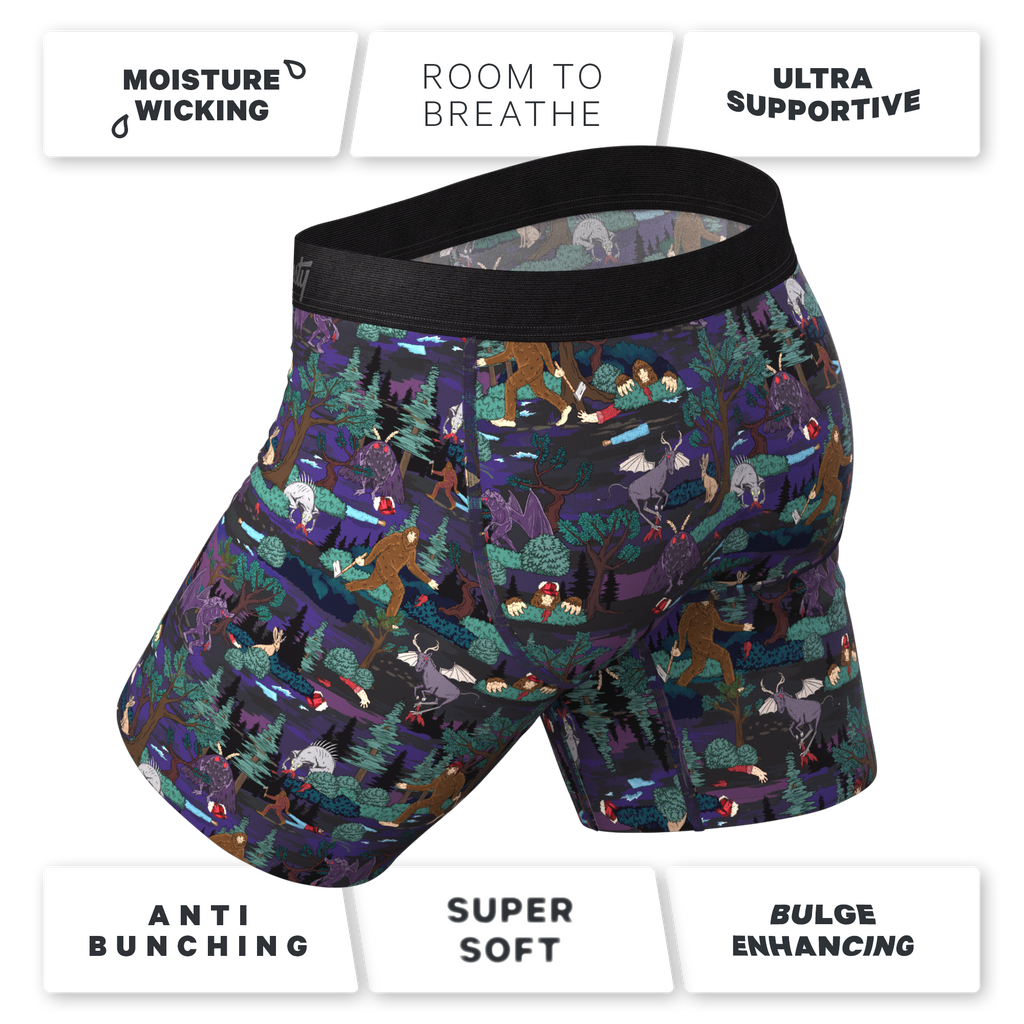 A pair of men's underwear with cartoon characters, a black fabric, and a sign.