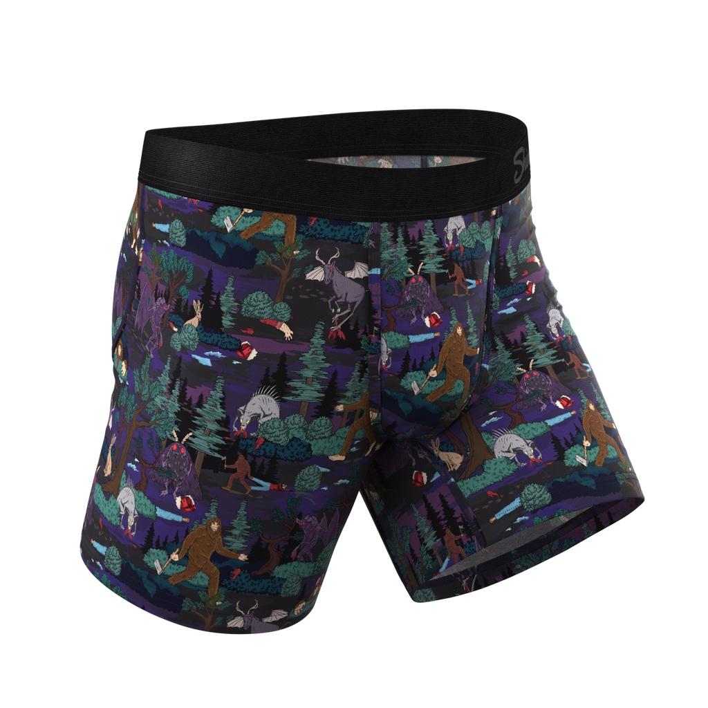 A pair of men's underwear featuring a spooky ball hammock® pouch with cryptid-themed cartoons.