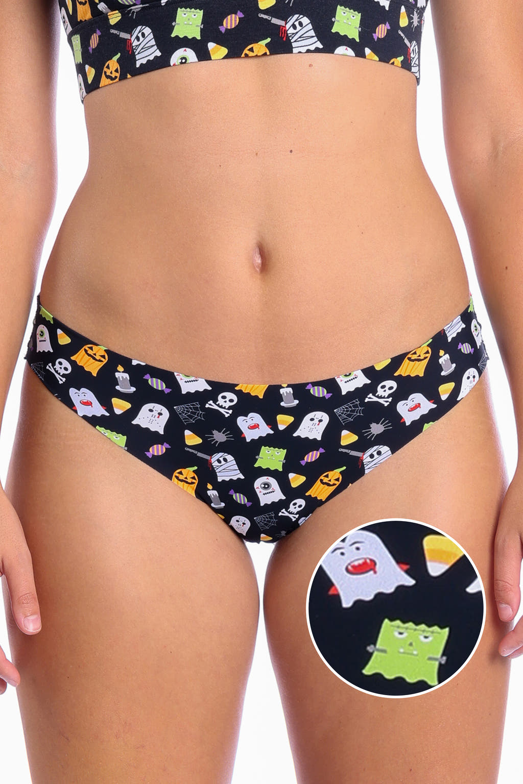 A close-up of The Good Ghouls Halloween Themed Seamless Thong featuring cute ghosts inspired by favorite Halloween monsters.