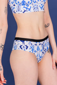 A close-up of a woman in The Risqué Rorschach Cheeky Underwear.