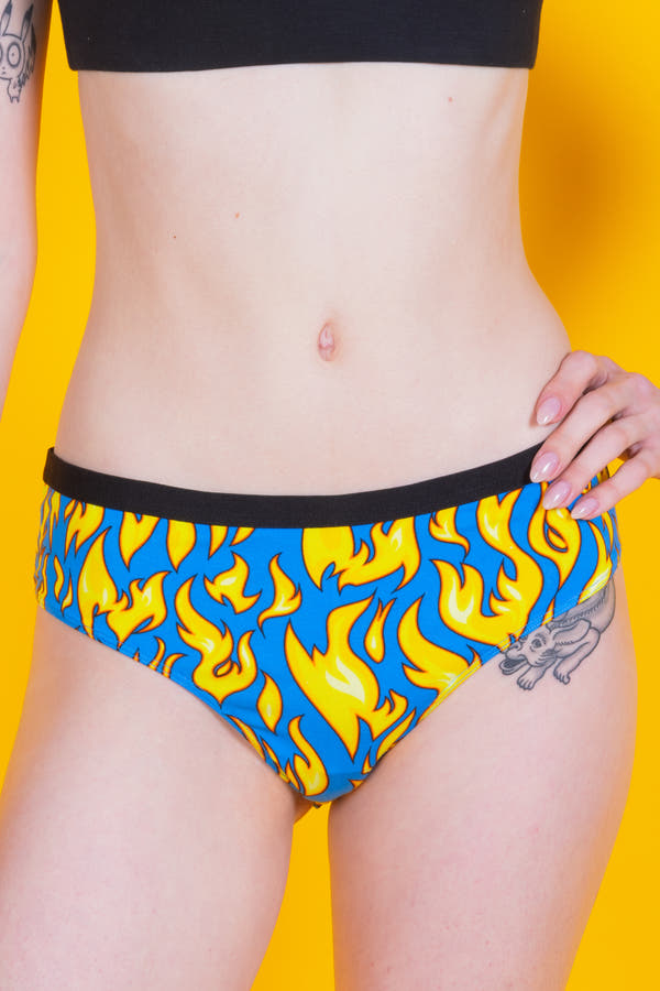 A woman wearing The Fire Crotch Flames Cheeky Underwear.
