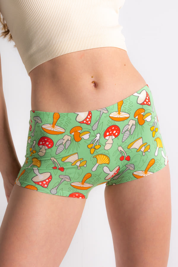 A whimsical image of a person wearing The Trip Advisor Mushroom Modal Boyshort Underwear by Shinesty, featuring a fun mushroom pattern.