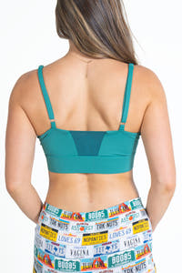 A woman in a green paradICE™ Cooling Bralette.