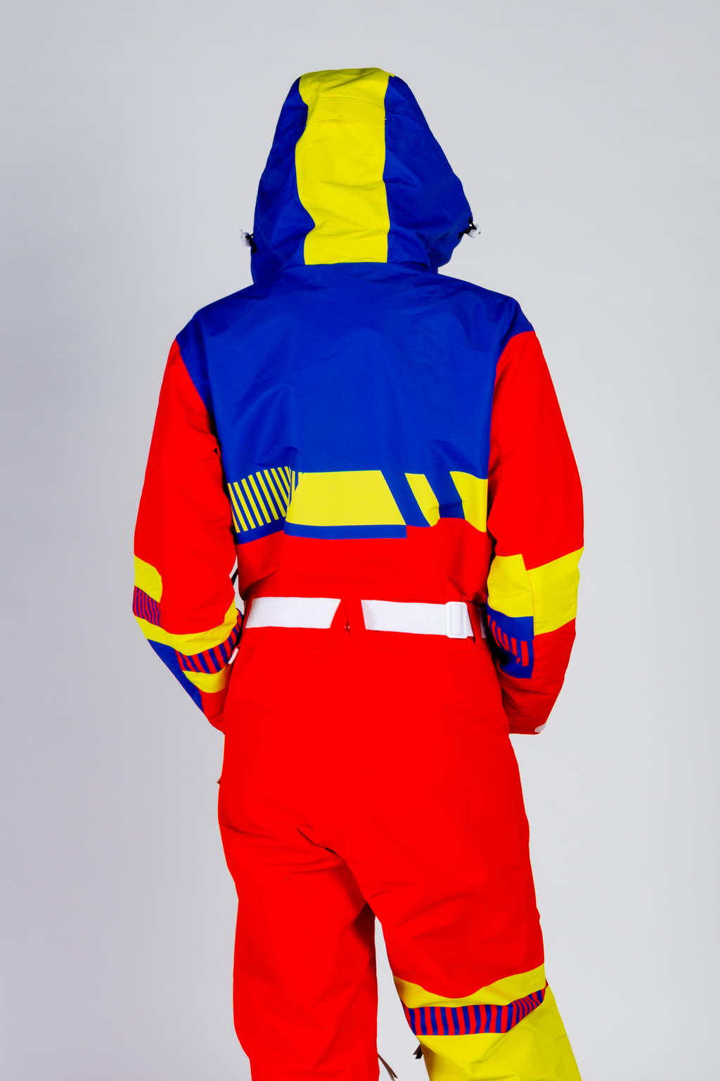 red yellow and blue snow suit