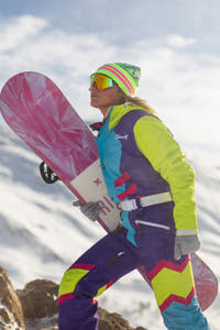 Retro womens ski suit on the mountain